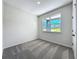 Cozy bedroom with plush carpeting and a bright window offering neighborhood views at 1112 W Line St, Leesburg, FL 34748