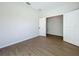 Well-lit bedroom features hardwood floors and neutral paint for a modern appeal at 1112 W Line St, Leesburg, FL 34748