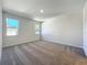 Bright bedroom featuring neutral carpeting and two windows that provide plenty of natural light at 1112 W Line St, Leesburg, FL 34748