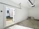 Bright garage with an open door, showing access to the home's exterior and tidy landscaping at 1112 W Line St, Leesburg, FL 34748