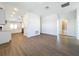 Spacious living room with hardwood floors and access to modern bathroom at 1112 W Line St, Leesburg, FL 34748
