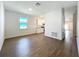 Spacious living room with hardwood floors and access to modern kitchen at 1112 W Line St, Leesburg, FL 34748