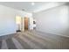 Spacious main bedroom with ensuite bathroom and walk-in closet entrances, carpeted for comfort at 1112 W Line St, Leesburg, FL 34748
