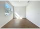 Bright office space with hardwood floors and natural light from the window at 1112 W Line St, Leesburg, FL 34748