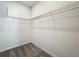 Bright walk-in closet featuring neutral carpet and wire shelving for optimal storage solutions at 1112 W Line St, Leesburg, FL 34748
