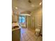 Well-lit bathroom with tiled floors, a corner shower, and a garden tub, designed for relaxation and functionality at 11290 Se 189Th Ct, Ocklawaha, FL 32179