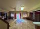 Spacious living room with a ceiling fan, curtains, and tile flooring, bathed in natural light from the sliding glass door at 11290 Se 189Th Ct, Ocklawaha, FL 32179