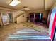 Open-concept living room with staircase, bar area, tile flooring, and large windows, perfect for entertaining at 11290 Se 189Th Ct, Ocklawaha, FL 32179