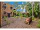 Private backyard featuring mature landscaping and a cozy bench, creating a serene outdoor space at 1141 S Osceola Ave, Orlando, FL 32806