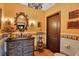 Charming bathroom with decorative tilework, unique vanity, and ornate chandelier lighting fixture at 1141 S Osceola Ave, Orlando, FL 32806