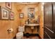Stylish bathroom with a unique pedestal sink, decorative tilework, and patterned terracotta floor at 1141 S Osceola Ave, Orlando, FL 32806