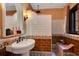 Stylish bathroom with white subway tile, earth tone trim, and a charming pedestal sink at 1141 S Osceola Ave, Orlando, FL 32806