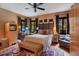Inviting bedroom with a ceiling fan, natural light, complemented by a patterned rug and furniture at 1141 S Osceola Ave, Orlando, FL 32806