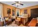 Cozy bedroom with wooden floors, bright window, and an array of decorative furniture and accents at 1141 S Osceola Ave, Orlando, FL 32806