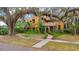 Elegant Spanish-style home surrounded by mature trees, showing its classic design and curb appeal at 1141 S Osceola Ave, Orlando, FL 32806