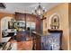 Charming kitchen featuring stainless steel appliances, dark wood cabinetry and an island with seating at 1141 S Osceola Ave, Orlando, FL 32806