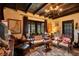 Charming living room with beamed ceilings, elegant decor, ornate furnishings, and inviting natural light at 1141 S Osceola Ave, Orlando, FL 32806