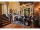 Elegant living room with a fireplace, hardwood floors, and a chandelier at 1141 S Osceola Ave, Orlando, FL 32806