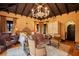 Spacious main bedroom featuring wood beamed ceiling, sitting area, and elegant decor at 1141 S Osceola Ave, Orlando, FL 32806