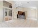 Spacious living room featuring tiled floors, high ceilings, and access to the patio at 12543 Waterhaven Cir, Orlando, FL 32828