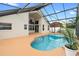 A covered pool and patio area create a seamless indoor-outdoor flow at 12543 Waterhaven Cir, Orlando, FL 32828