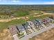 An aerial view showcases the home's proximity to a golf course, offering a lifestyle of leisure at 15843 Vetta Dr, Bella Collina, FL 34756