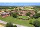 Aerial view of the estate homes and landscaped grounds at 15843 Vetta Dr, Bella Collina, FL 34756