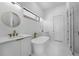 Luxurious bathroom featuring double vanities, a freestanding tub, and modern fixtures at 15843 Vetta Dr, Bella Collina, FL 34756