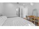 Bright bedroom showing closet, ensuite bathroom, and desk setup at 15843 Vetta Dr, Bella Collina, FL 34756