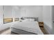 Bright bedroom featuring large windows, wood floors and neutral decor at 15843 Vetta Dr, Bella Collina, FL 34756