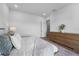 Well-lit bedroom features minimalist design and a neutral color palette for a calming retreat at 15843 Vetta Dr, Bella Collina, FL 34756