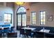 Inviting dining area featuring comfortable booth seating and natural light at 15843 Vetta Dr, Bella Collina, FL 34756