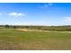 Expansive golf course view featuring verdant fairways, sand traps and a scenic landscape at 15843 Vetta Dr, Bella Collina, FL 34756