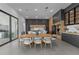 Open-concept kitchen with an island, dining table, modern cabinetry, and stainless steel appliances at 15843 Vetta Dr, Bella Collina, FL 34756