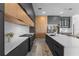 Contemporary kitchen featuring an island with bar seating, stainless steel appliances, and modern finishes at 15843 Vetta Dr, Bella Collina, FL 34756