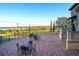 Outdoor patio with elegant wrought iron furniture and scenic views of the water at 15843 Vetta Dr, Bella Collina, FL 34756