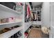 Organized walk-in closet with shelves and rods, offering plenty of storage for clothes and accessories at 15843 Vetta Dr, Bella Collina, FL 34756