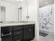 Bathroom with tile floor, dark vanity with granite countertop, and shower with decorative curtain at 16310 Rock Coast Dr, Winter Garden, FL 34787