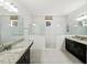 Bathroom with granite counters, a large mirror, recessed lights, a tiled floor, and a spacious glass shower at 16310 Rock Coast Dr, Winter Garden, FL 34787