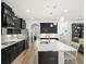 Bright kitchen with stainless steel appliances, a large island with bar seating and ample counter space at 16310 Rock Coast Dr, Winter Garden, FL 34787
