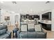 Open-concept living area showcasing kitchen with barstool seating and dining area beyond at 16310 Rock Coast Dr, Winter Garden, FL 34787