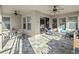 Covered patio area with ceiling fans and tiled flooring, perfect for outdoor lounging and entertaining at 16310 Rock Coast Dr, Winter Garden, FL 34787