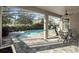 Inviting pool area featuring a screened enclosure, outdoor seating, and a beautiful pool at 16310 Rock Coast Dr, Winter Garden, FL 34787