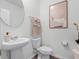 Clean bathroom featuring a pedestal sink, and minimalist artwork at 16323 Lakelet Aly, Winter Garden, FL 34787