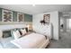 Bright bedroom with stylish decor, featuring a comfortable white bed and complementing wall art at 16323 Lakelet Aly, Winter Garden, FL 34787