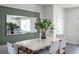 An airy dining room featuring a stylish table and decorative mirror, complemented by modern decor at 16323 Lakelet Aly, Winter Garden, FL 34787