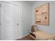 Hallway featuring wood floors, a cozy bench, and decor at 16323 Lakelet Aly, Winter Garden, FL 34787