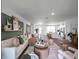 Spacious living area with stylish furniture and decor in an open-concept floor plan at 16323 Lakelet Aly, Winter Garden, FL 34787