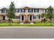 Charming townhomes with blue shutters and front door and manicured landscaping at 16329 Lakelet Aly, Winter Garden, FL 34787