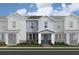 Charming new construction townhome with brick accents, inviting porch, and neat landscaping at 167 Aulin Ave, Oviedo, FL 32765
